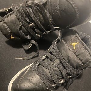 Black Sneakers with Gold Logo